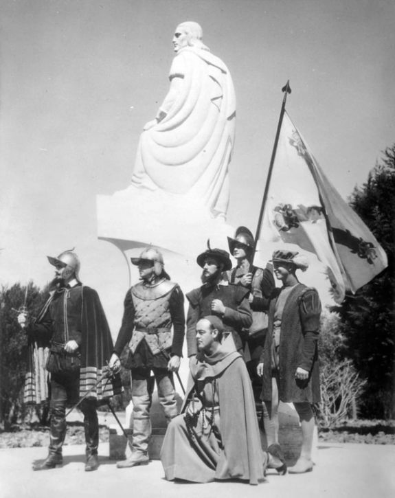 Reenactors pose with a statue of Juan Rodriguez Cabrillo