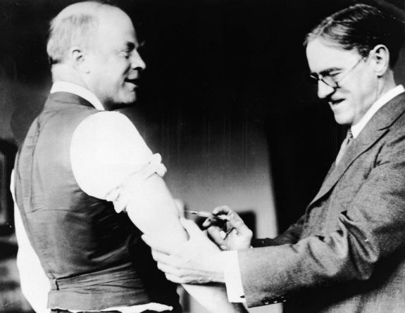 A doctor inoculates Major Peters of Boston against the Spanish Influenza virus
